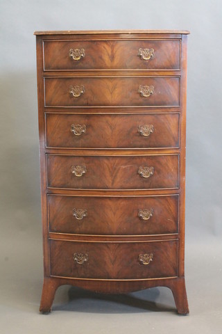 A Georgian style mahogany bow front chest of 6 long drawers raised on splayed bracket feet 25"