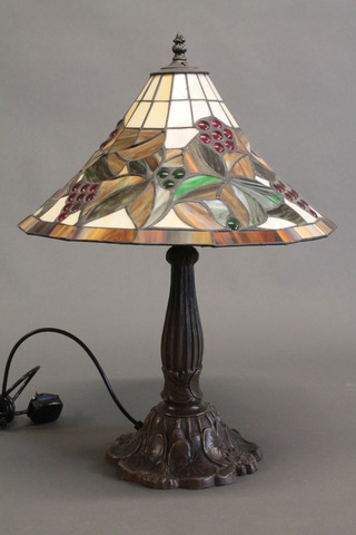 A bronzed Liberty style table lamp with lead glass shade