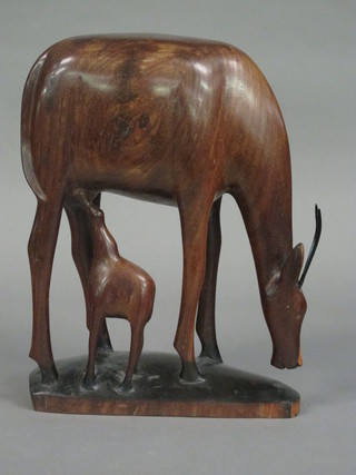An African carved hardwood figure of a standing gazelle and calf 17"