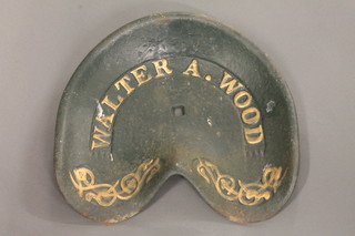 A cast iron mower seat marked Walter A Wood