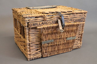 A basket work pigeon carrier with hinged lid marked D Millard,  53 Stanford Road, Crawley