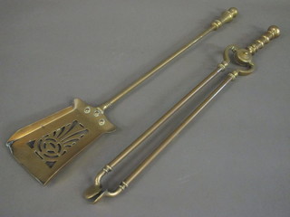 A 19th Century pierced brass coal shovel and a pair of tongs