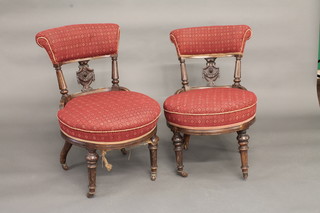 A pair of walnut bar back chairs with vase shaped slat backs and upholstered seats, raised on turned and fluted supports