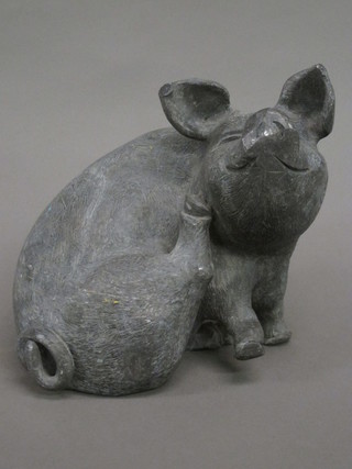A cast lead figure of a seated pig 9"