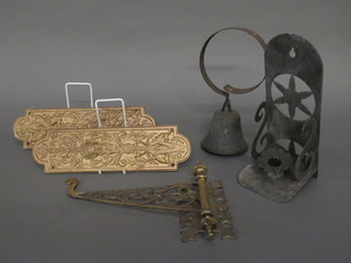 A pair of Victorian embossed metal finger plates, a servants bell, a pierced brass bracket and a metal candle bracket