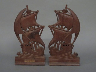 A pair of carved wooden bookends in the form of galleons