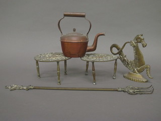 A brass gondolier finial in the form of a sea horse 8", 2 brass trivets, a toasting fork and a copper kettle