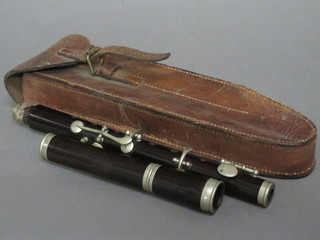A wooden piccolo by George Potter & Co Aldershot, complete with  leather carrying case