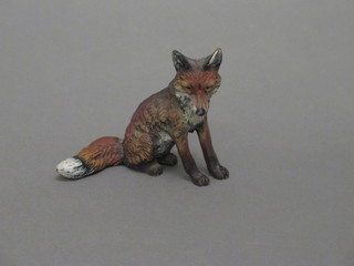 A painted bronze figure of seated fox 2"