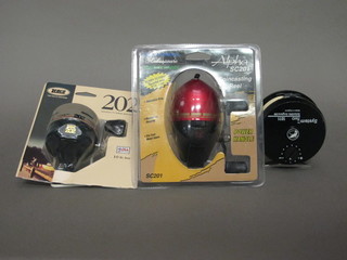 A Shakespeare Alpha SC 201 spinning reel, a Zebco 202  spinning reel, as new, and a System TM TWO 1011 reel