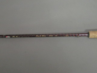 An ADU Fly-max Black Max twin section carbon fibre fishing rod