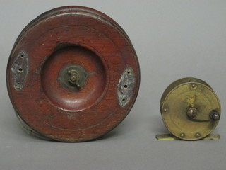 A brass centre pin fishing reel 2 1/2" and a star back fishing reel 5"