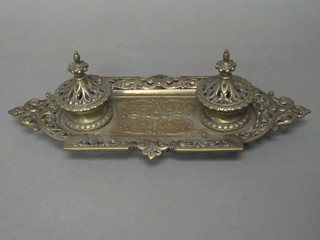 A rectangular 19th Century pierced gilt metal inkwell with hinged lid complete with china liner 13"