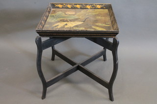 A Regency style rectangular lacquered tray decorated birds and raised on X framed stand 21"
