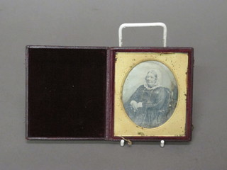 An early Daguerreotype by Mr Kilburn of a seated lady,  contained in a leather case