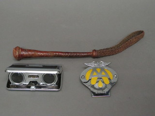 A pair of 2.5 x 25mm pocket binoculars, an AA radiator badge  and a leather covered priest