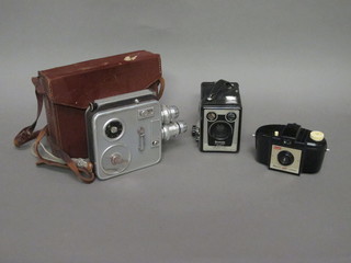 An Admira 8 cine camera in leather case, a Brownie model E  camera and a Kodak Brownie 127