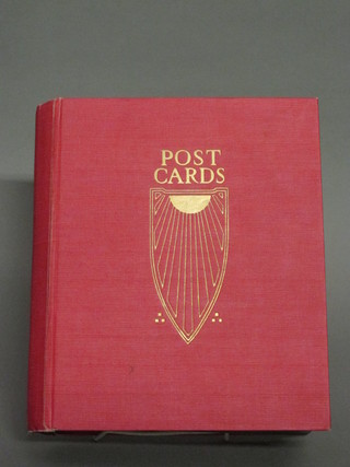 A red card album of various postcards