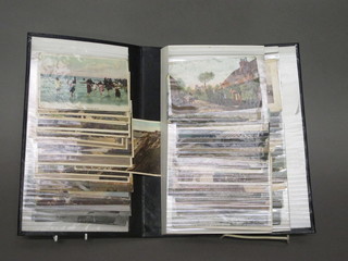 A black loose leaf album of various postcards
