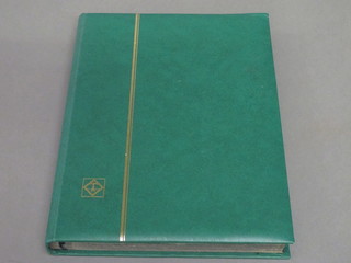 A green stock book of Olympic stamps