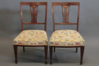 A pair of 19th Century mahogany slat and bar back nursing bedroom/chairs with upholstered seats, raised on square tapering  supports ending in spade feet