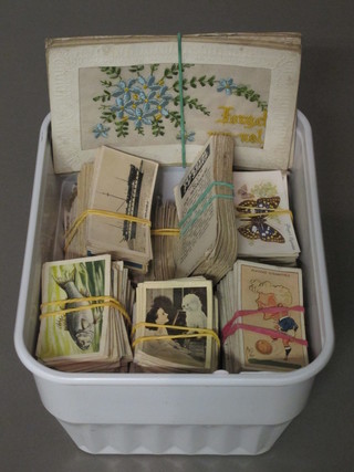 A collection of embroidered postcards and cigarette cards