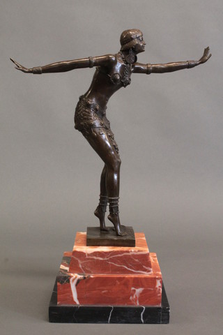A bronze Art Deco style figure of a dancing lady, raised on a stepped marble base 19"
