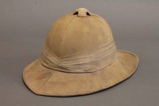 A military issue pith helmet dated 1942