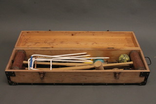 A Townsend croquet set comprising 4 mallets, 9 balls, 7 hoops, contained in a wooden carrying case