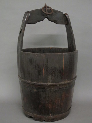 A carved wooden well bucket