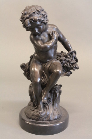 A bronze figure of a seated cherub with basket of flowers 14"