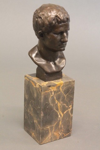 A bronze head and shoulders portrait bust, raised on a square marble base, 10" overall