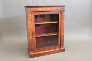 A Victorian mahogany Pier cabinet, the shelved interior enclosed  by glazed panelled doors, raised on a platform base 29"