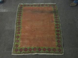 An orange ground tribal rug decorated multi-row borders 53" x  38"