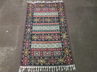 An Eastern stitch work rug 63" x 34"