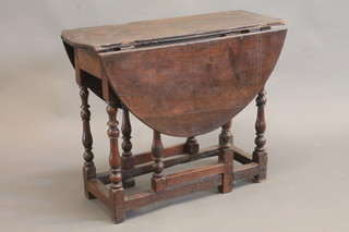 A 17th/18th Century oak oval drop flap gateleg tea table, raised  on turned supports 32"