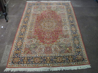 A rust ground machine made Belgian cotton rug with central  medallion, 93" x 59"