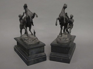 A pair of spelter Marley horses, raised on marble bases 12"