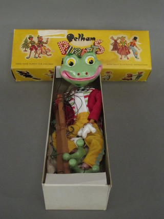 A Pelham puppet in the form of a frog, boxed