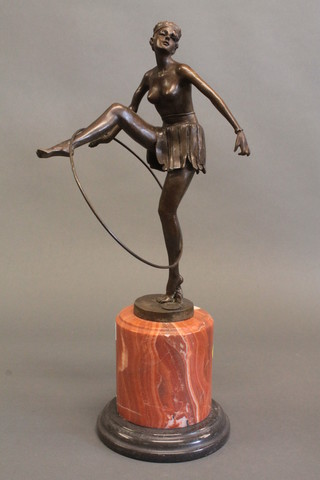 An Art Deco style bronze figure of a dancing girl with hoop,  raised on a marble base 20"