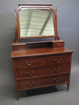 An Edwardian inlaid mahogany dressing chest with mirror fitted  2 glove drawers above 2 short and 2 long drawers, raised on  turned supports ending in spade feet 42"
