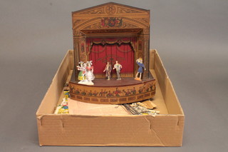 A Pollock's toy theatre with various back drops, figures, stands  etc