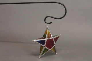 A stained glass star shaped lantern complete with bracket