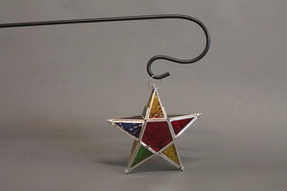 A garden stained glass star shaped lantern complete with bracket