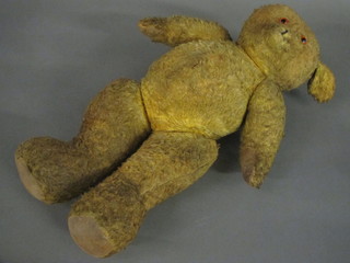 A yellow teddybear with articulated limbs 22"