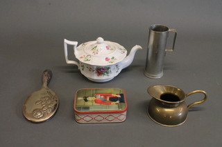 A Rockingham style circular teapot with floral decoration, a square Delft flask and a small collection of china and glass, a 3  piece silver backed dressing table set, a folding camera and a  small collection of brassware