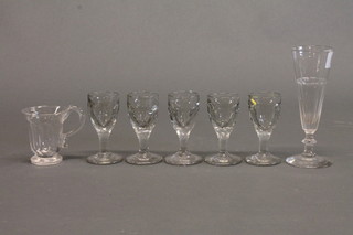 An antique glass champagne flute, a custard glass and 5 liqueur  glasses