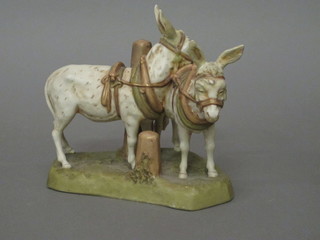 A Royal Dux figure group of 2 standing donkeys, the base with  pink triangular mark 6", ears restored,  ILLUSTRATED
