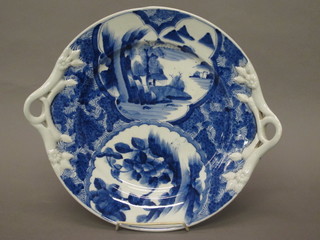 A circular Oriental twin handled porcelain bowl, the base with 6 character mark 14"