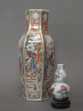 An Oriental octagonal vase decorated court figures 12" and an Oriental porcelain double gourd shaped vase with floral  decoration 4"